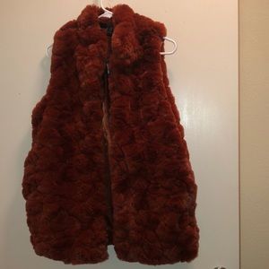This is an orange faux fur vest by Rachel Zoe from Marshalls